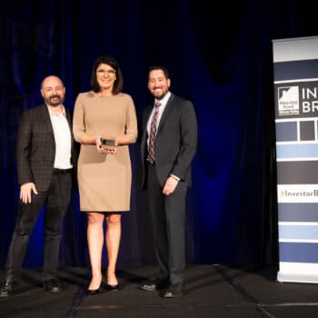 Charlie Giancarlo, CEO of Pure Storage, Katie Ferrick, Sr. Director of Workplace, Community & Environment of LinkedIn, and Kevin Zwick, CEO of Housing Trust Silicon Valley, presenting Katie with the 2019 Housing Champion Award