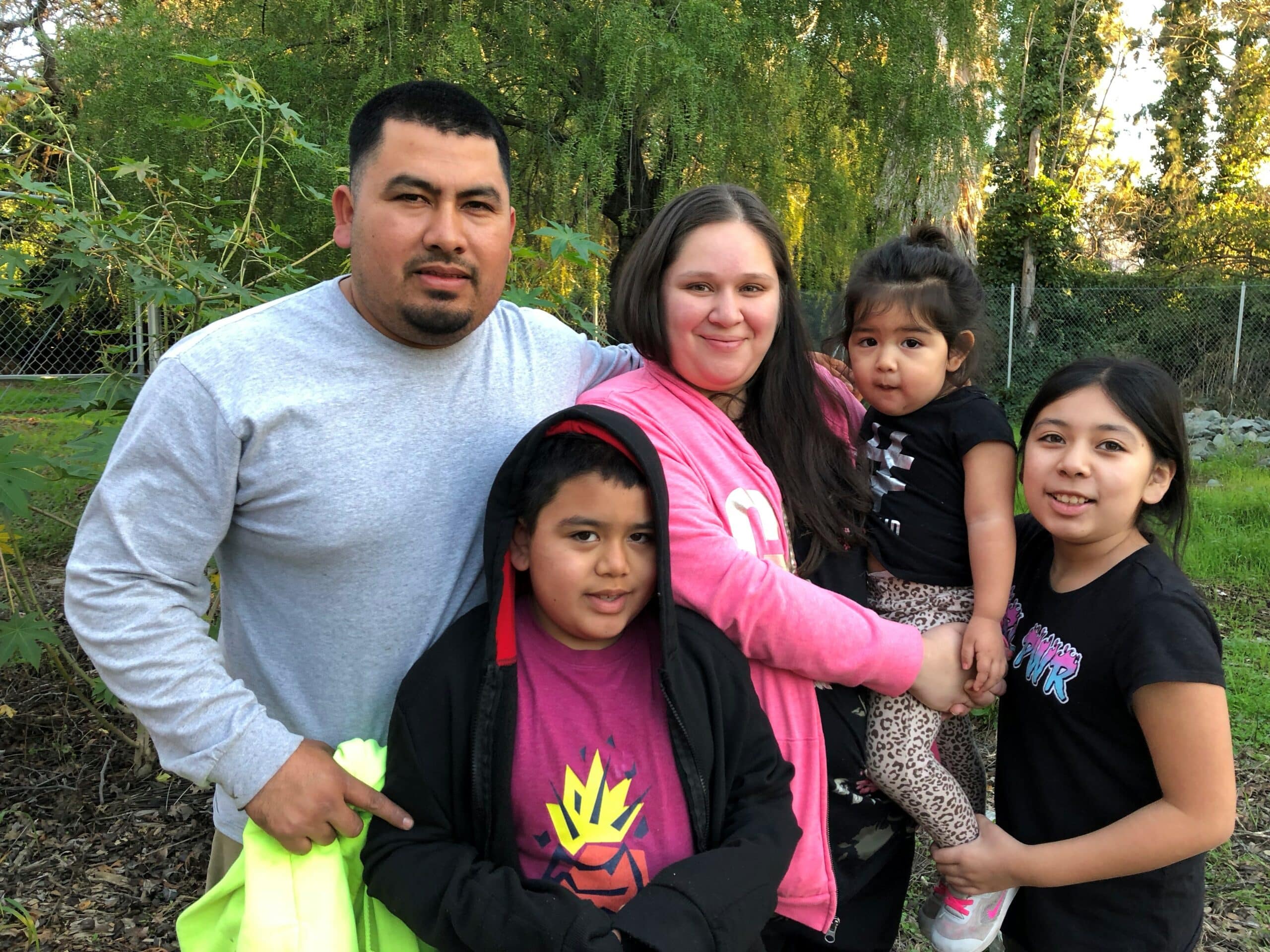 Griselda and family in the community garden at Betty Ann Gardens